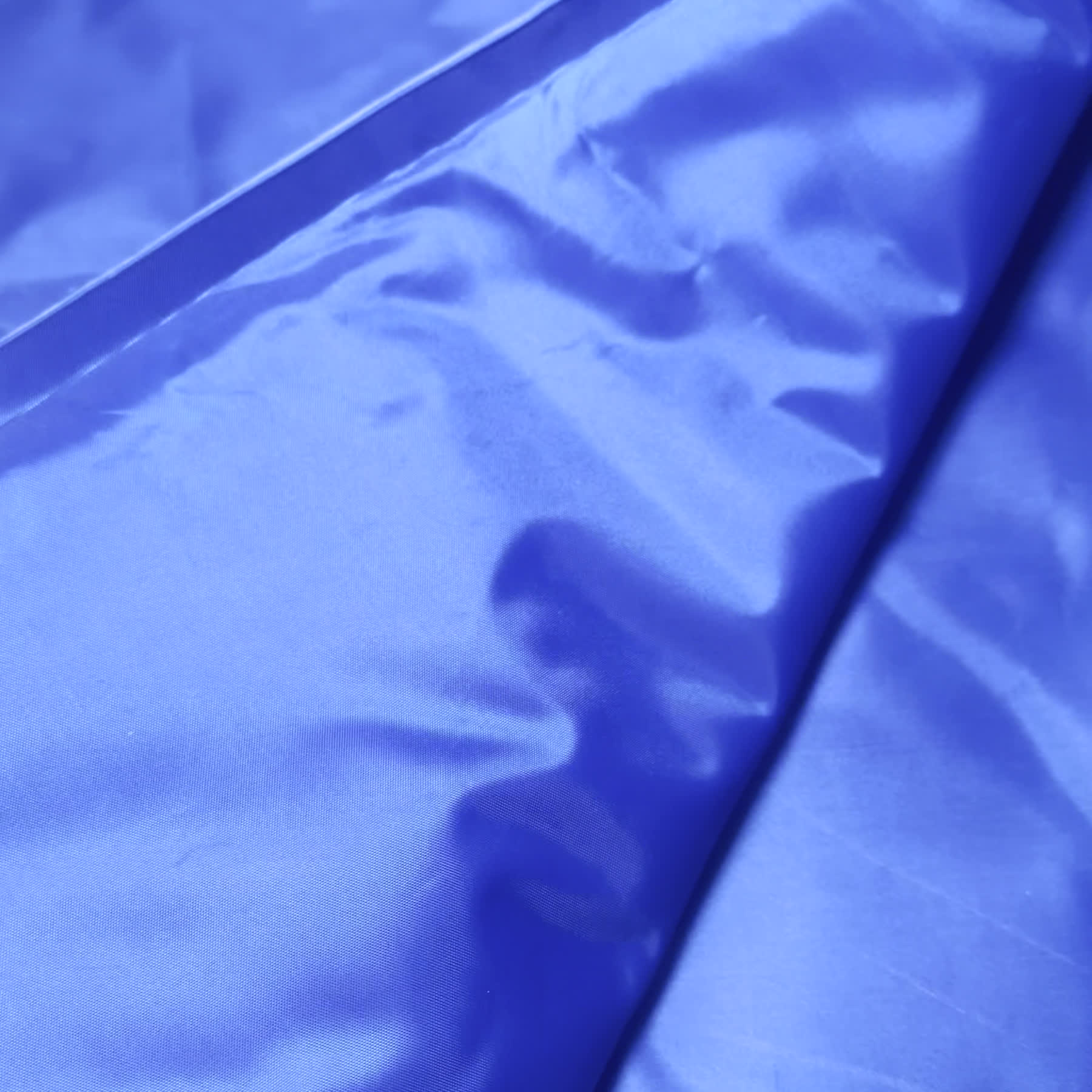 Close-up of the wipe-clean waterproof surface and sealed seam of the GlacierPup cooling mat